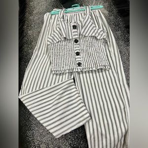 Black and white striped pants with top, elegant style.
